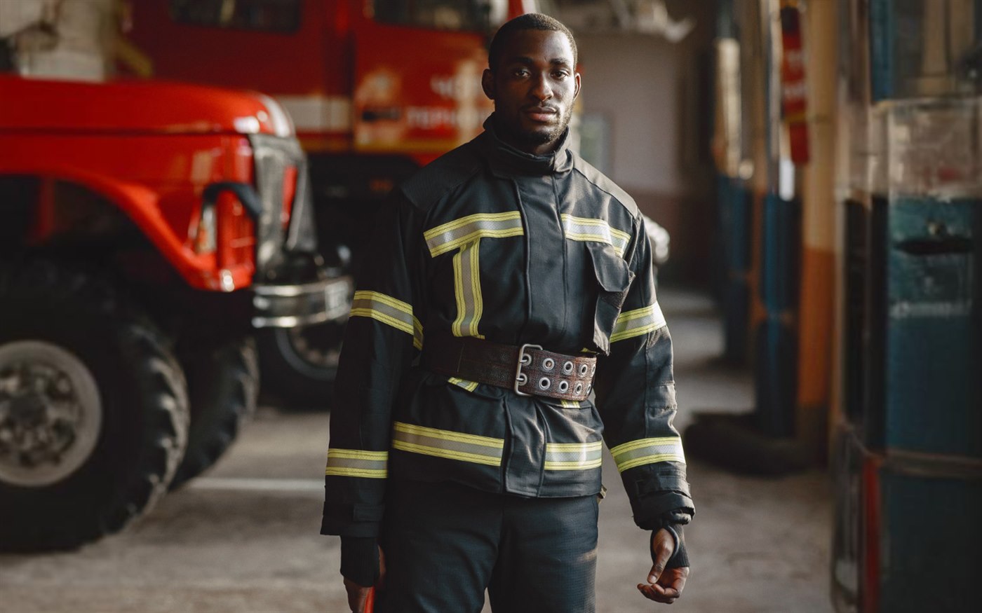 A firefighter standing during a demanding work shift